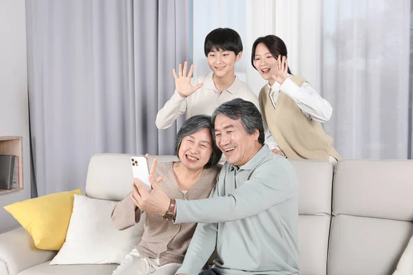 Asian Korean Family Taking Selfie — стокове фото