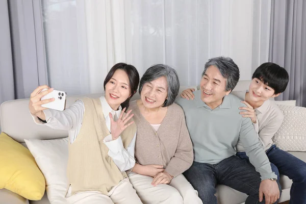 Asian Korean Family Taking Selfie — стокове фото