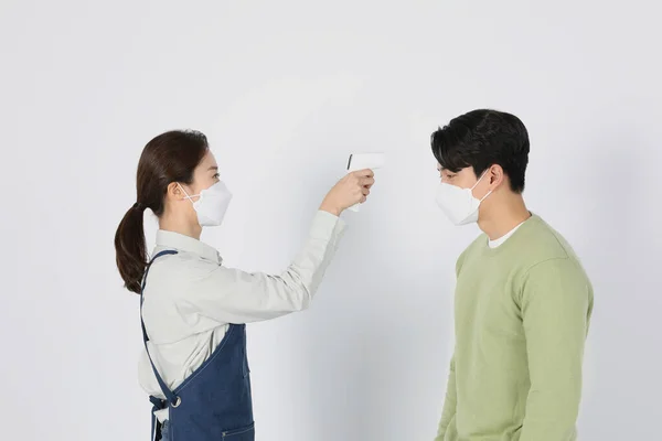 Asian Korean Young Man Woman Startup Concept_ Checking Body Temperature — стокове фото