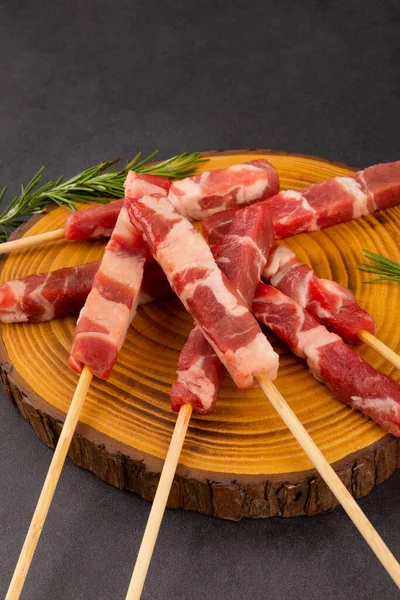 raw lamb meat on skewers