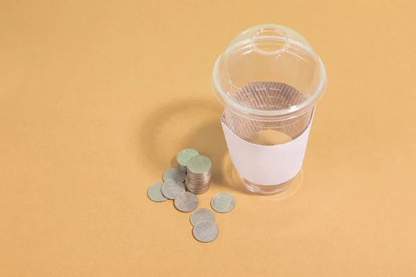 protect earth and environment concept, plastic cup and coin, return for cash