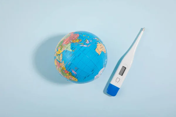 protect earth and environment concept, globe and thermometer