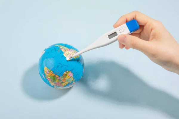 protect earth and environment concept, globe and thermometer