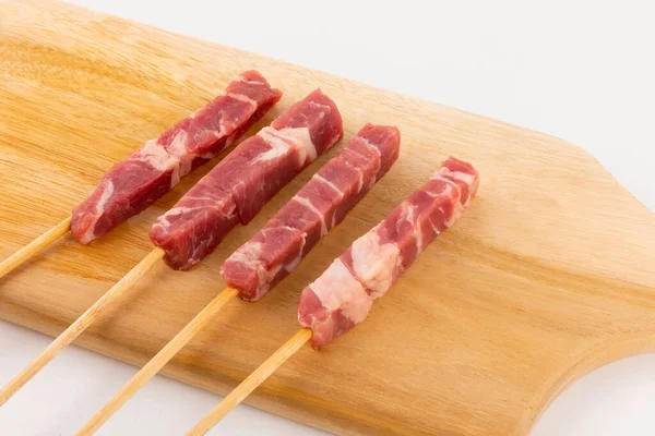 raw lamb meat skewers