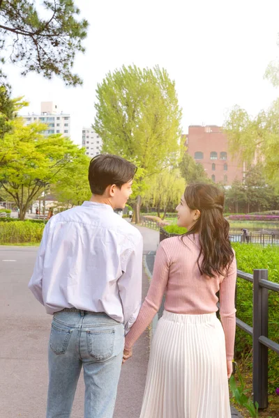 Korean Asian Couple Enjoying Spring Date_Hugging — Zdjęcie stockowe