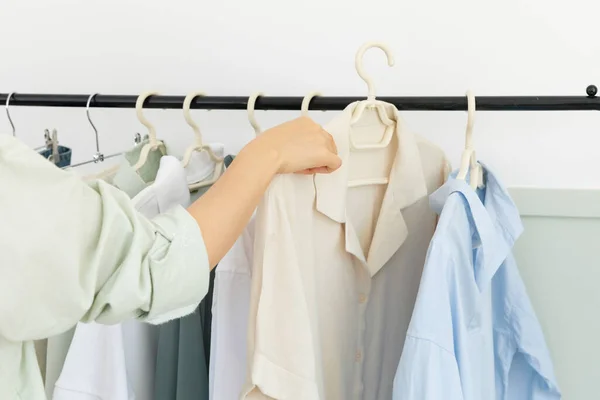 aesthetic laundry concept, clothes hung on a hangers