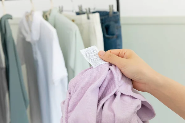 Aesthetic Laundry Concept_Checking Washing Label Instructions — Stock Fotó