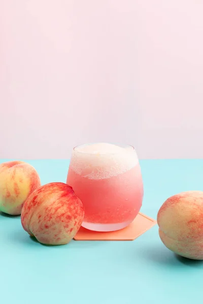 summer background with peach ade drink with peaches fruit