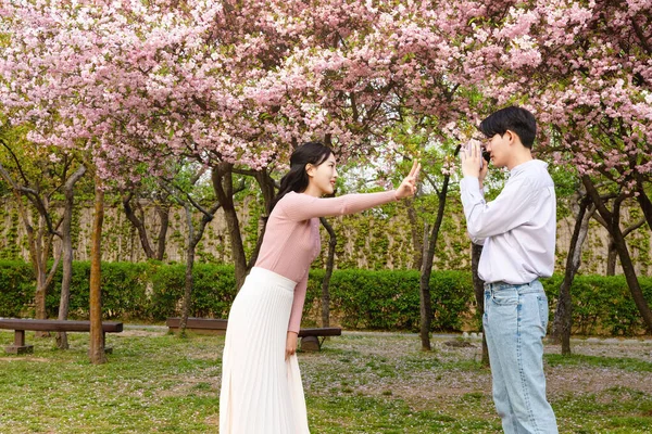 Korean Asian Couple Enjoying Spring Date_Holding Flowers —  Fotos de Stock