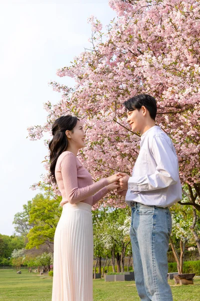 Korean Asian Couple Enjoying Spring Date_Holding Hands — ストック写真