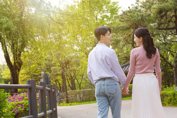 Korean Asian Couple Enjoying Spring Date_Holding Hands —  Fotos de Stock