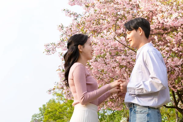 Korean Asian Couple Enjoying Spring Date_Holding Hands — ストック写真