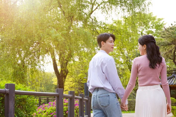 Korean Asian Couple Enjoying Spring Date_Holding Hands — Stock Photo, Image