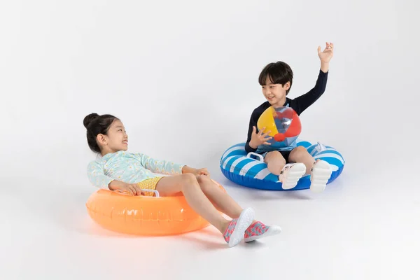 Korean Boy Girl Summer Concept White Background_ Sitting Inflatable Pool — Stock Photo, Image