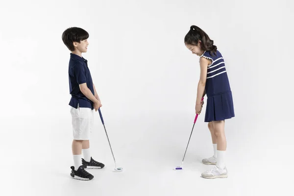 Korean Boy Girl_Fitness Exercise Concept White Background__Looking One Golfing Friend —  Fotos de Stock