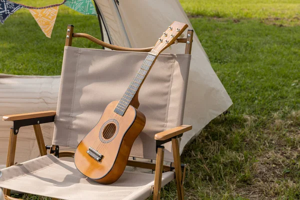 camping mood aesthetics, camping gear and ukulele