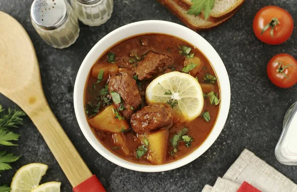 In two hours, the Tyrolean goulash soup will be ready. Serve it with sour cream and herbs, you can put a slice of lemon on the plate. Bon Appetit!