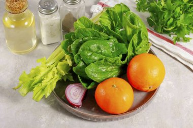 Prepare all the ingredients needed to make the Celery Tangerine Salad. Choose tangerines that are sweet and delicious.
