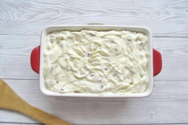Put the spaghetti with curd mass and cherries in a baking dish. Brush the top of the casserole with sour cream. clipart
