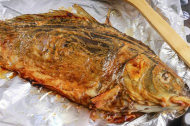 Preheat the oven to 180 degrees and bake the fish for about 40-50 minutes, depending on the size.