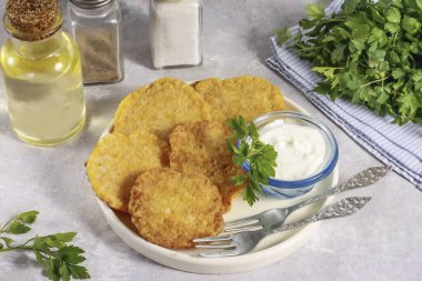 Place the carp roe pancakes on a plate and serve with sour cream or other sauce.