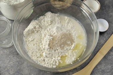 Pour in olive oil and warm water.