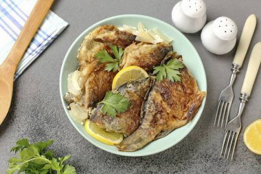 Crucian carps in milk in the oven are ready. When serving, the fish can be garnished with fresh herbs and lemon wedges. Bon Appetit!