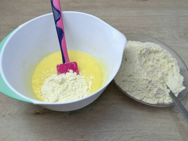 stock image In several steps (about 50 grams each), add flour with baking powder, knead the dough.