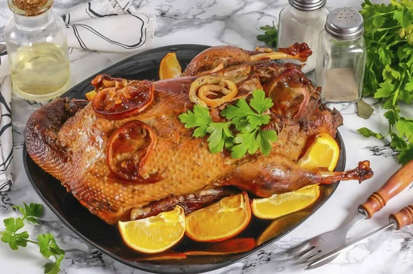 Carefully place the duck on a plate or dish and serve. Drain the fat into a small container and cook other dishes on it.