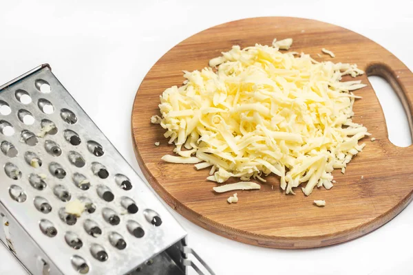 Grated Yellow Cheese Wooden Board Metal Grater — Stock Photo, Image
