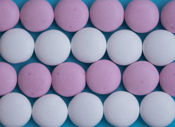 round candies on a blue background