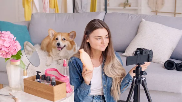 A Young Woman, a Beauty Blogger Shoots Her Video Blog about Beauty. Review of Cosmetics Live at Home. Influential Freelancer. Next Generation of Beauty Influencers