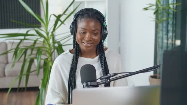 African American Streamer Broadcasts Live on a Laptop in a Broadcast Studio. — Wideo stockowe