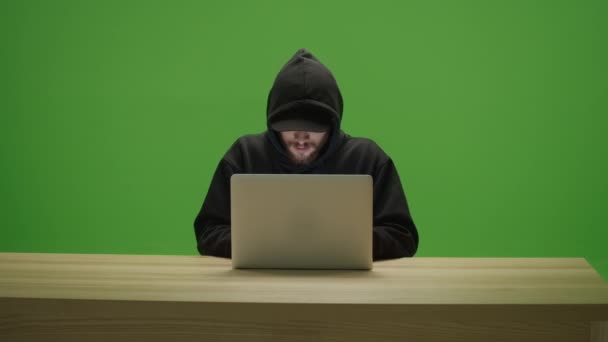 Unrecognizable Man Hacker Wearing Sweatshirt Hood Cap Typing Laptop Computer — Stock Video