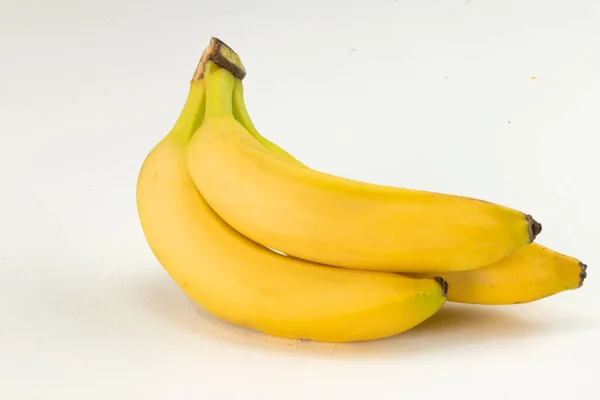 Trzy Banany Białym Tle Zdjęcia Stockowe bez tantiem