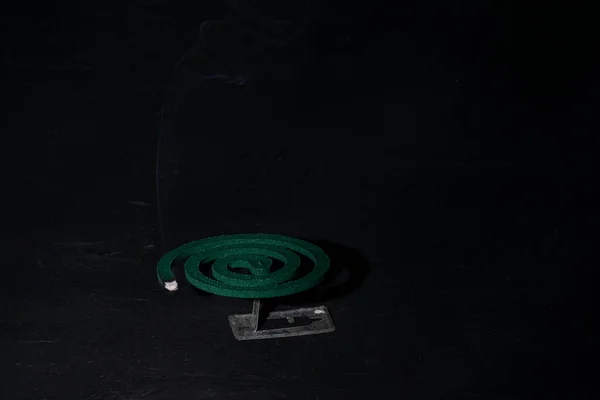 Lit Green Mosquito Coil Black Background — Stockfoto