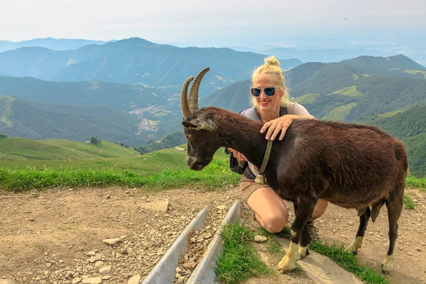 Woman with goat on Monte Generoso — Stock Photo, Image
