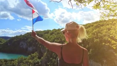 Croatian flag on the waterfalls of Plitvice Lakes National Park