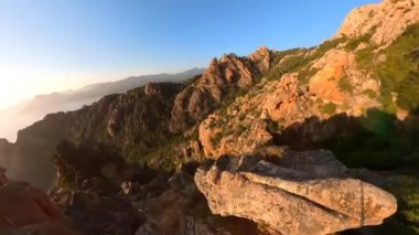 The badlands Calanques of Piana. Aerial view of the D81 road route in Corsican Calanques on Mediterranean sea close to the Porto Ota town. 360 view. UNESCO heritage