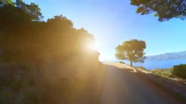 sunset aerial HYPER-LAPSE aerial view of the road D824 route of the Piana Badlands. Les Calanques of Piana, a natural park of Corsica on the Mediterranean sea by the Porto Ota town. 360 view