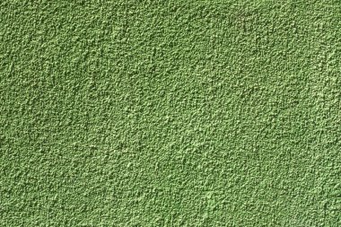 Kabataslak desenli boyalı bir duvar. Fırça desenli yeşil alçı, ev duvarı, kopyalama alanı