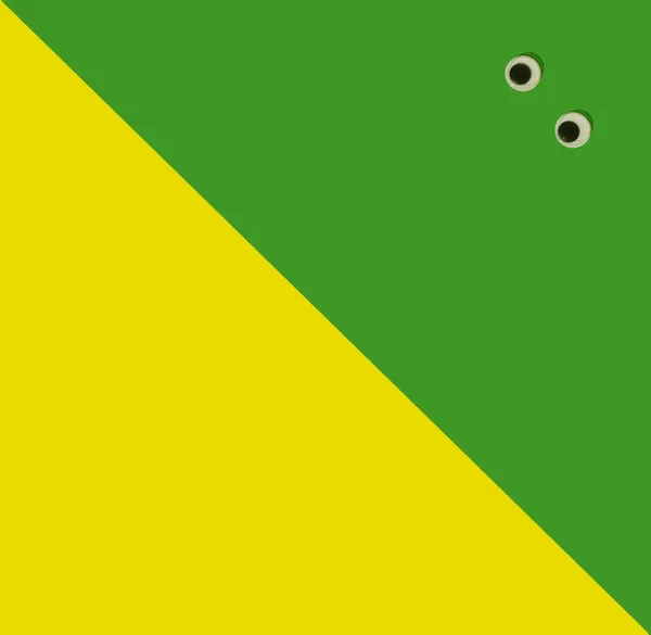 Frightened Eyes Lay Green Yellow Background Flat Lay Square Geometric — Stock Photo, Image