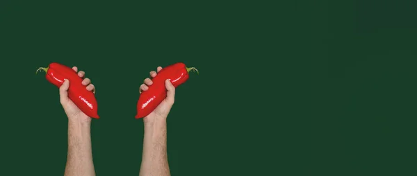 Male Hands Holding Red Paprikas Dark Green Background Minimal Flat — Stockfoto