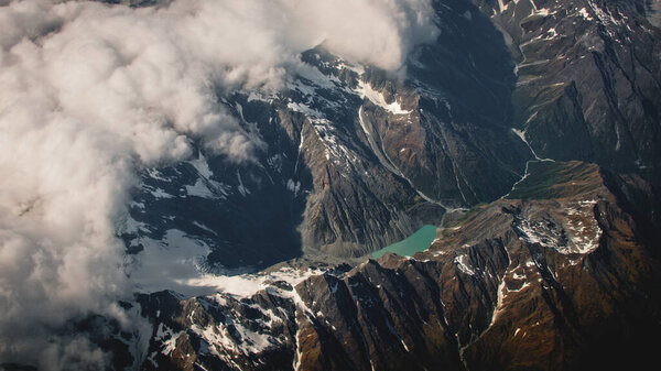 Amazing Aerial View of Mountains with Dense White Clouds