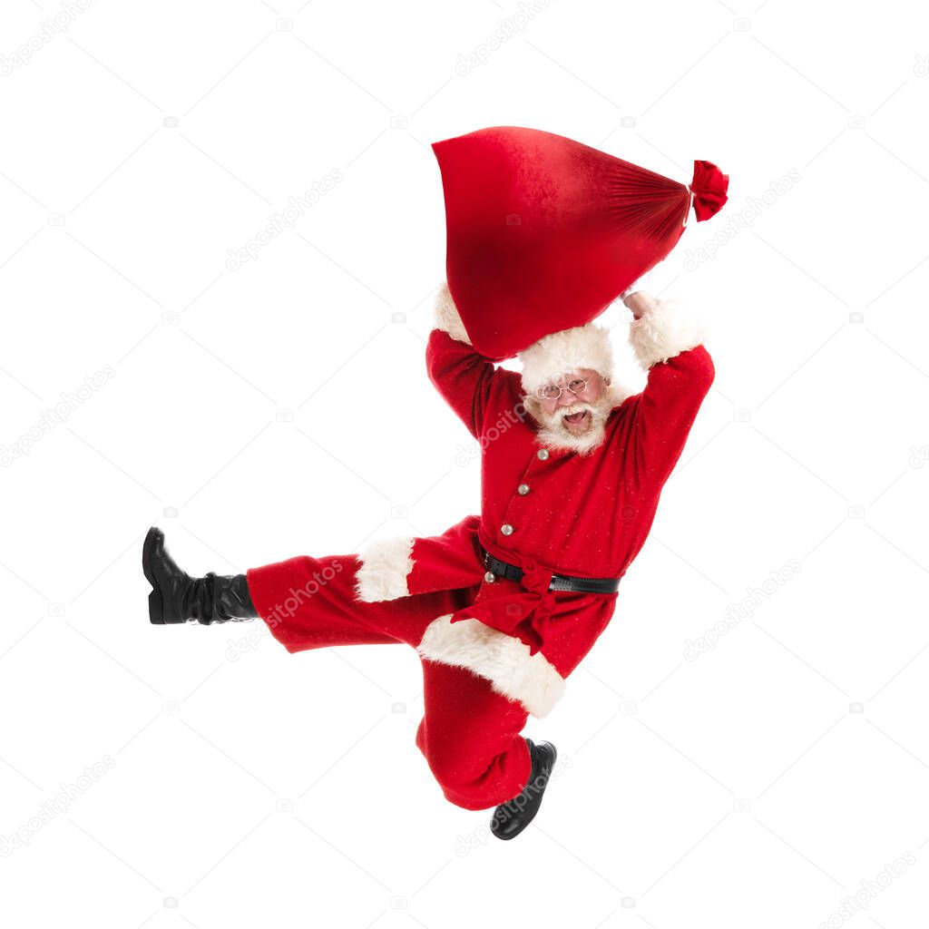 Santa Claus jump with gifts bag isolated on white background
