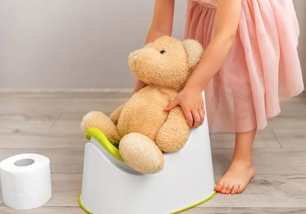 Child Teaches Toy How Use Potty — Stock Photo, Image