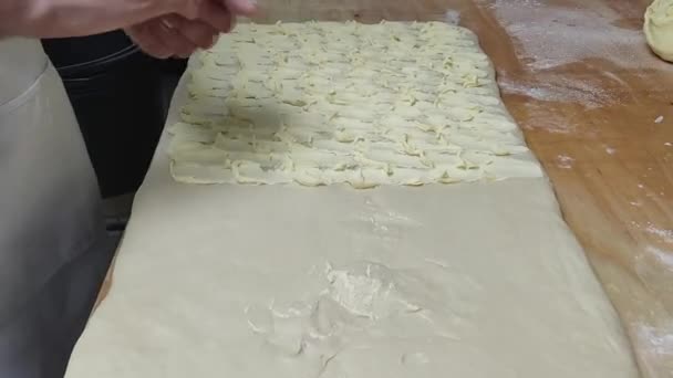 Man Puts Butter Dough Makes Puff Pastry — Stock Video