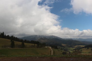 Sweeping views over the tree lined and occasionally snowy valleys and hills of the Black forest around Badenweiler in southern Germany near the border with Switzerland at the heart of Europe