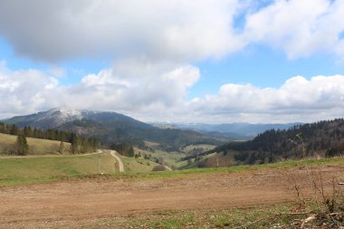 Sweeping views over the tree lined and occasionally snowy valleys and hills of the Black forest around Badenweiler in southern Germany near the border with Switzerland at the heart of Europe