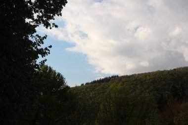 Sweeping views over the tree lined and occasionally snowy valleys and hills of the Black forest around Badenweiler in southern Germany near the border with Switzerland at the heart of Europe